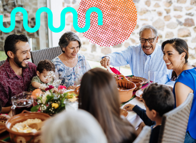 Hispanic family sharing food at a table