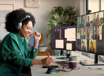 A woman wearing headphones on a video call for Patterns by Carnegie Learning, the best professional development for math teachers.